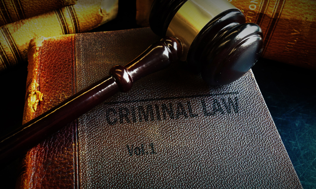 Old Criminal Law books and court gavel